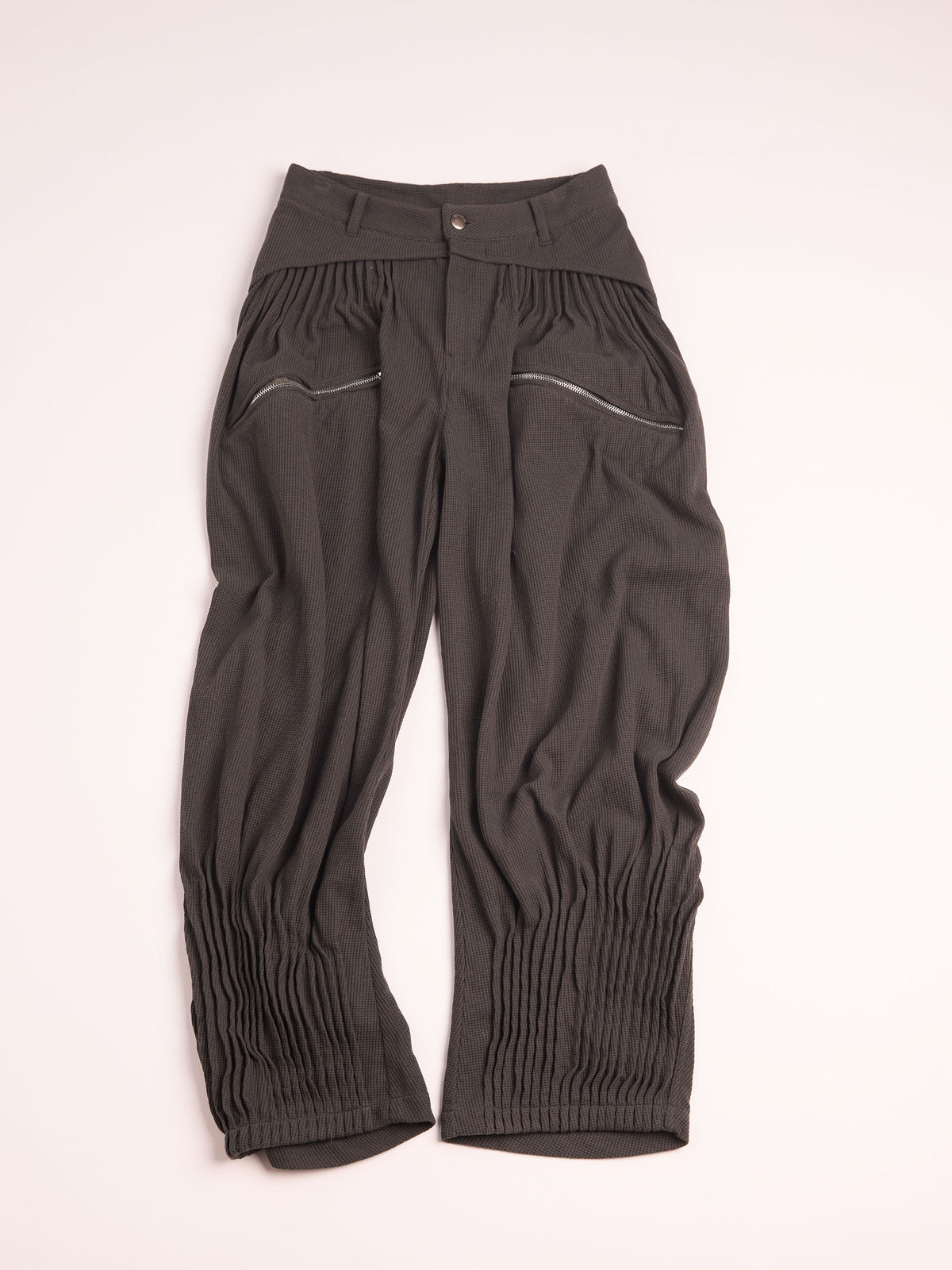 “NEXUS” PLEATED CARGO TROUSERS