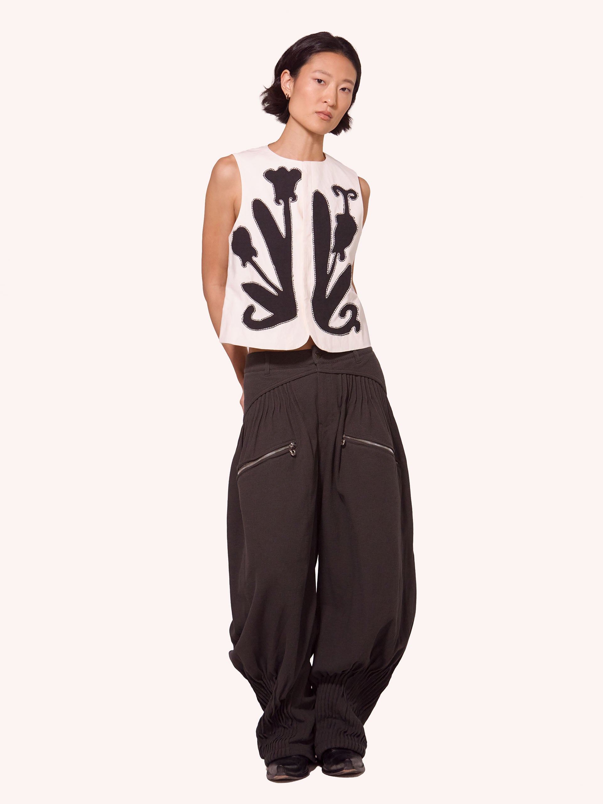 “NEXUS” PLEATED CARGO TROUSERS