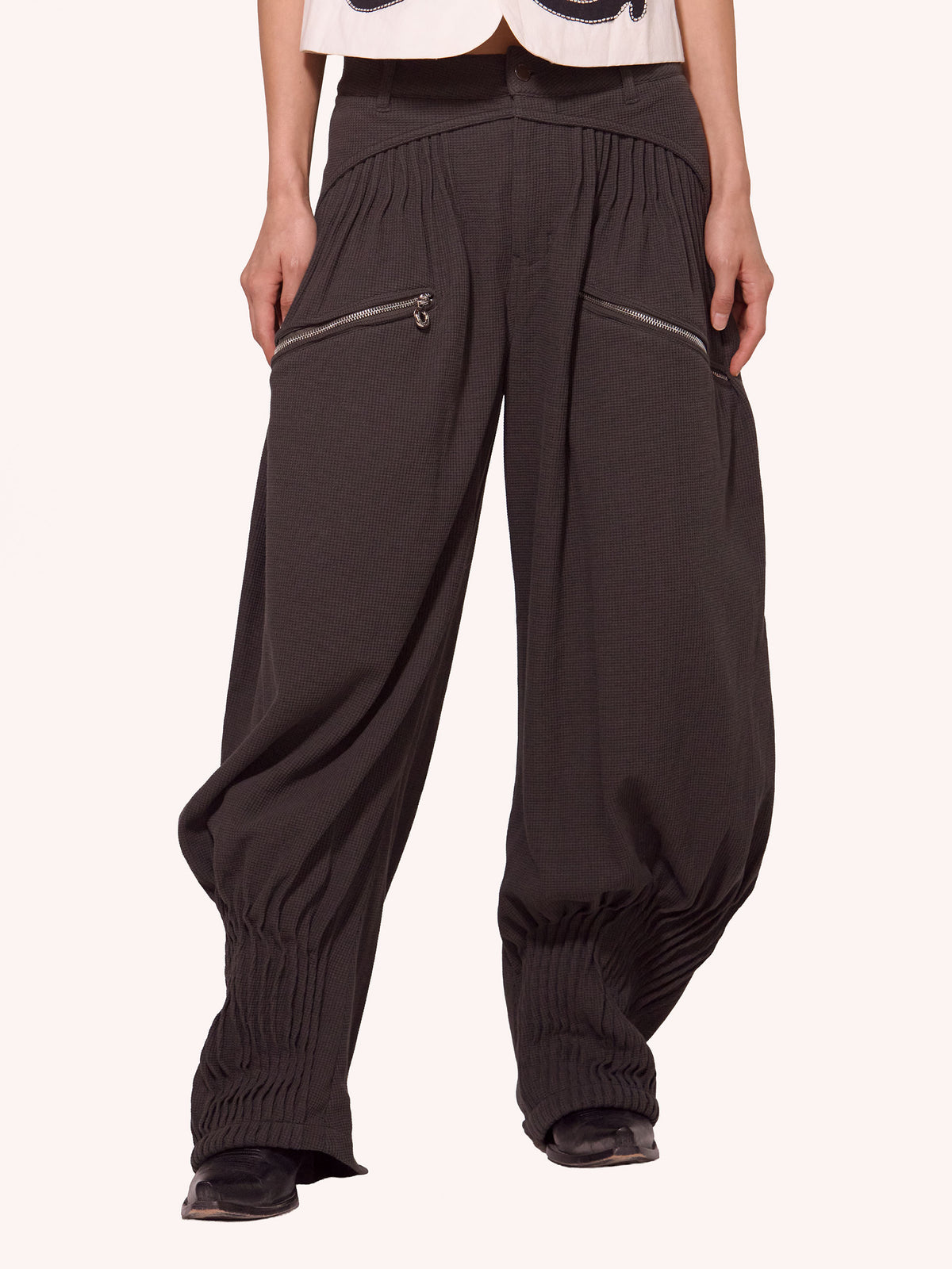 “NEXUS” PLEATED CARGO TROUSERS
