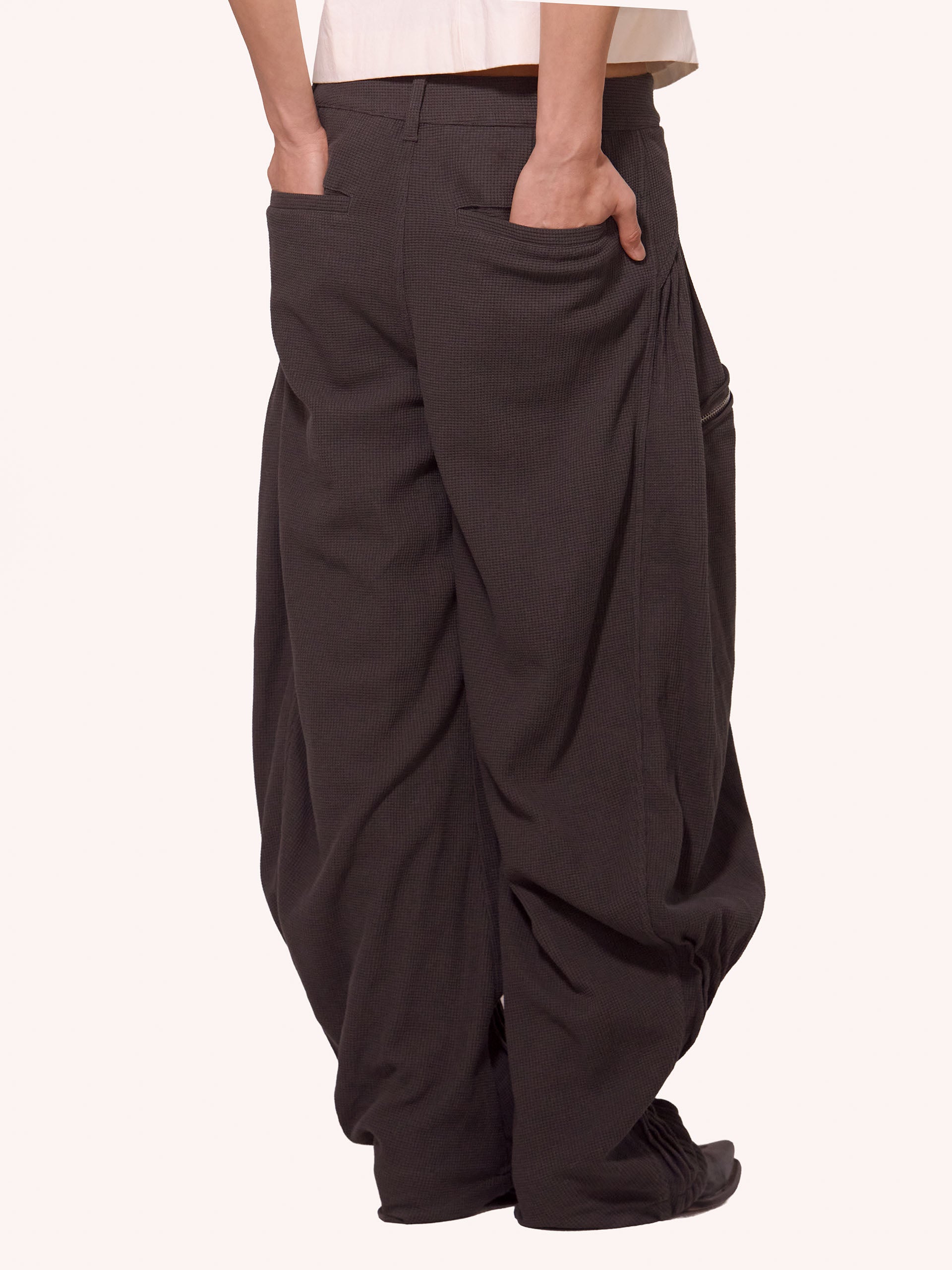 “NEXUS” PLEATED CARGO TROUSERS