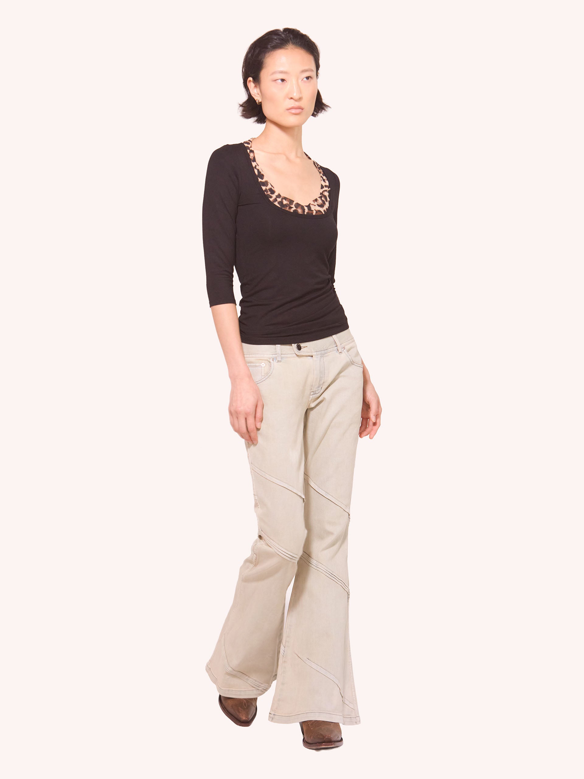 “PORTAL" PLEATED FLARED DENIM TROUSERS