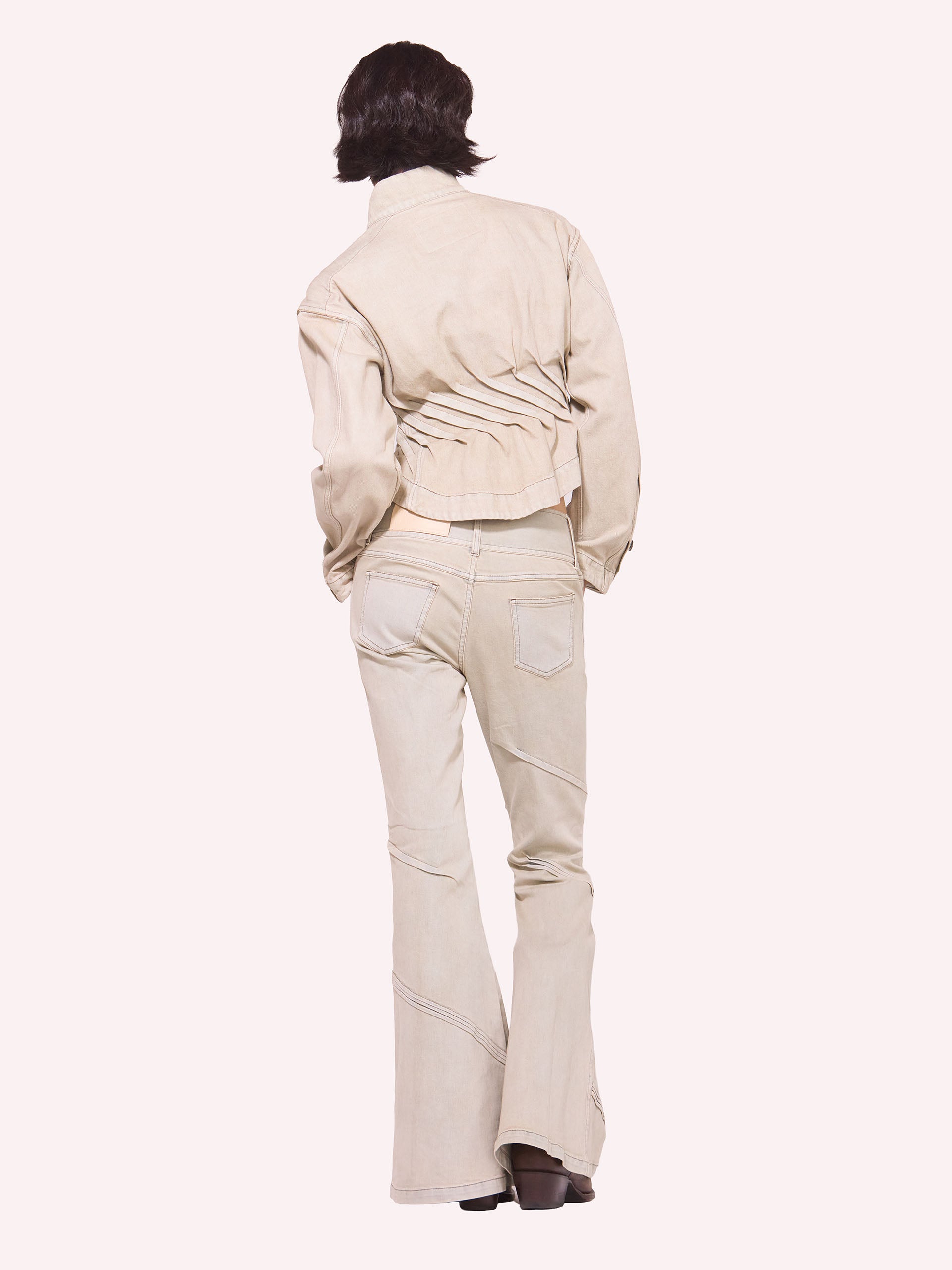 “PORTAL" PLEATED FLARED DENIM TROUSERS